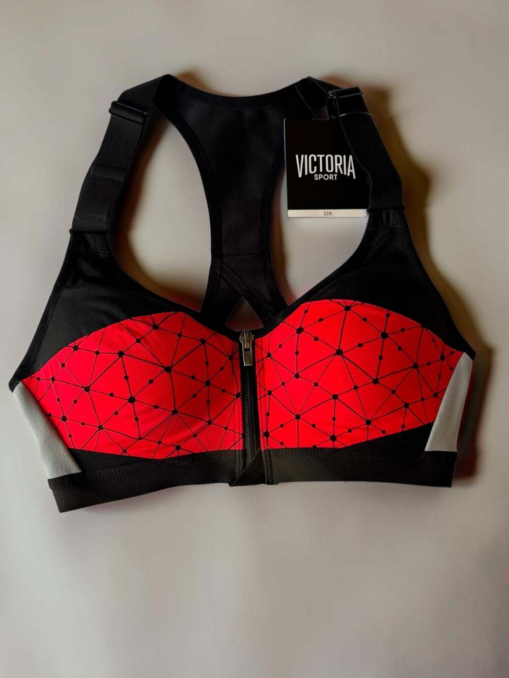 Victoria Sport Front-Zip High-Impact Sports Bra in Red and Black Geometric Print